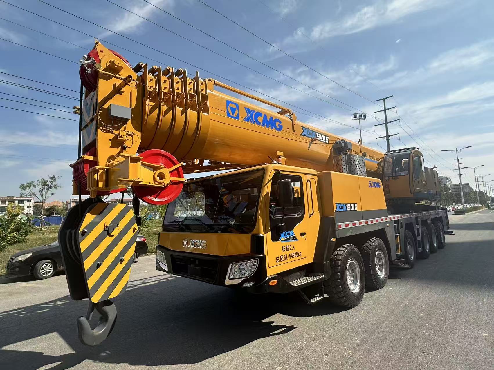 Original XCMG XCT130, rated lifting capacity 130 ton, strong main boom for stable heavy hoisting.